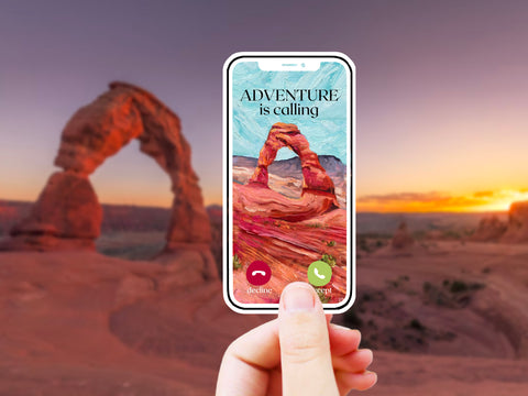 "Adventure is Calling" nature desert vinyl sticker for your water bottle, laptop, car sticker, journal, window, or other smooth surface.  Perfect for personalizing your belongings or as a gift for someone who loves traveling, camping, or hiking in the desert or at Arches National Park in Utah.